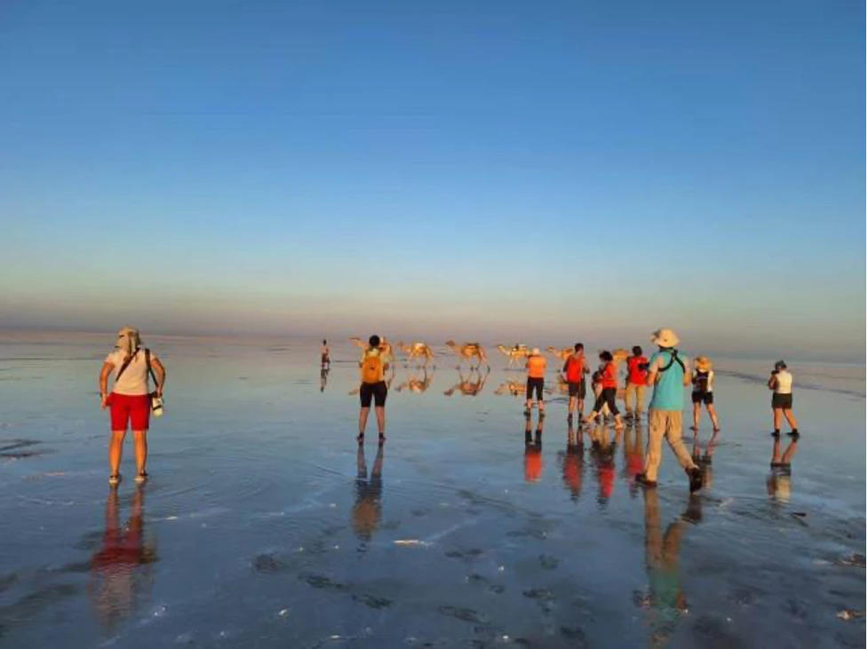 Travelers watching sunset on the Danakil salt flats